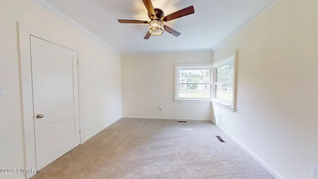 a view of an empty room with a window