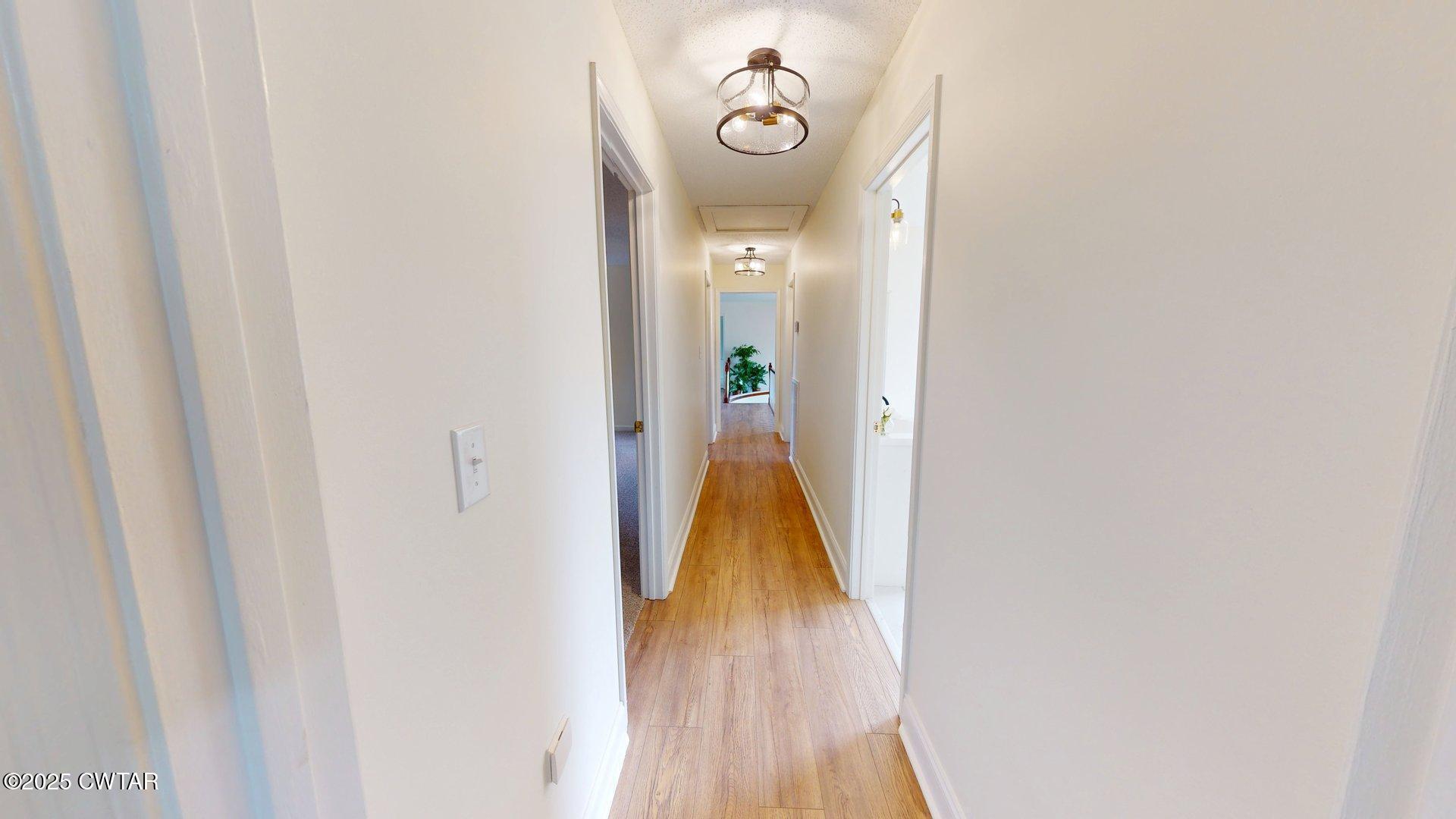 404 West Main Street Newbern, TN 38059 - Photo 25 of 35 a view of walk in closet with wooden floor