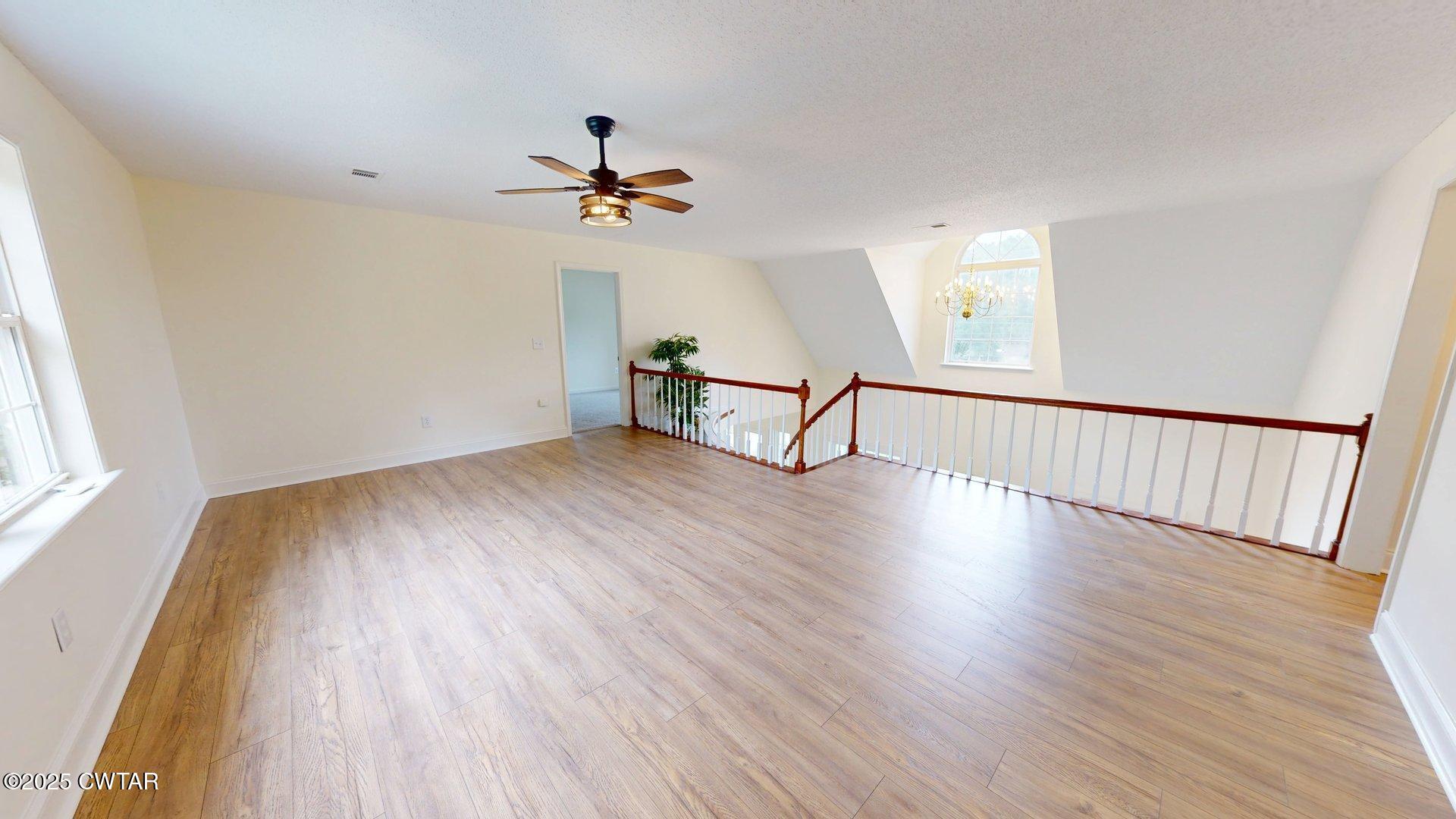 404 West Main Street Newbern, TN 38059 - Photo 26 of 35 a view of empty room with wooden floor and fan