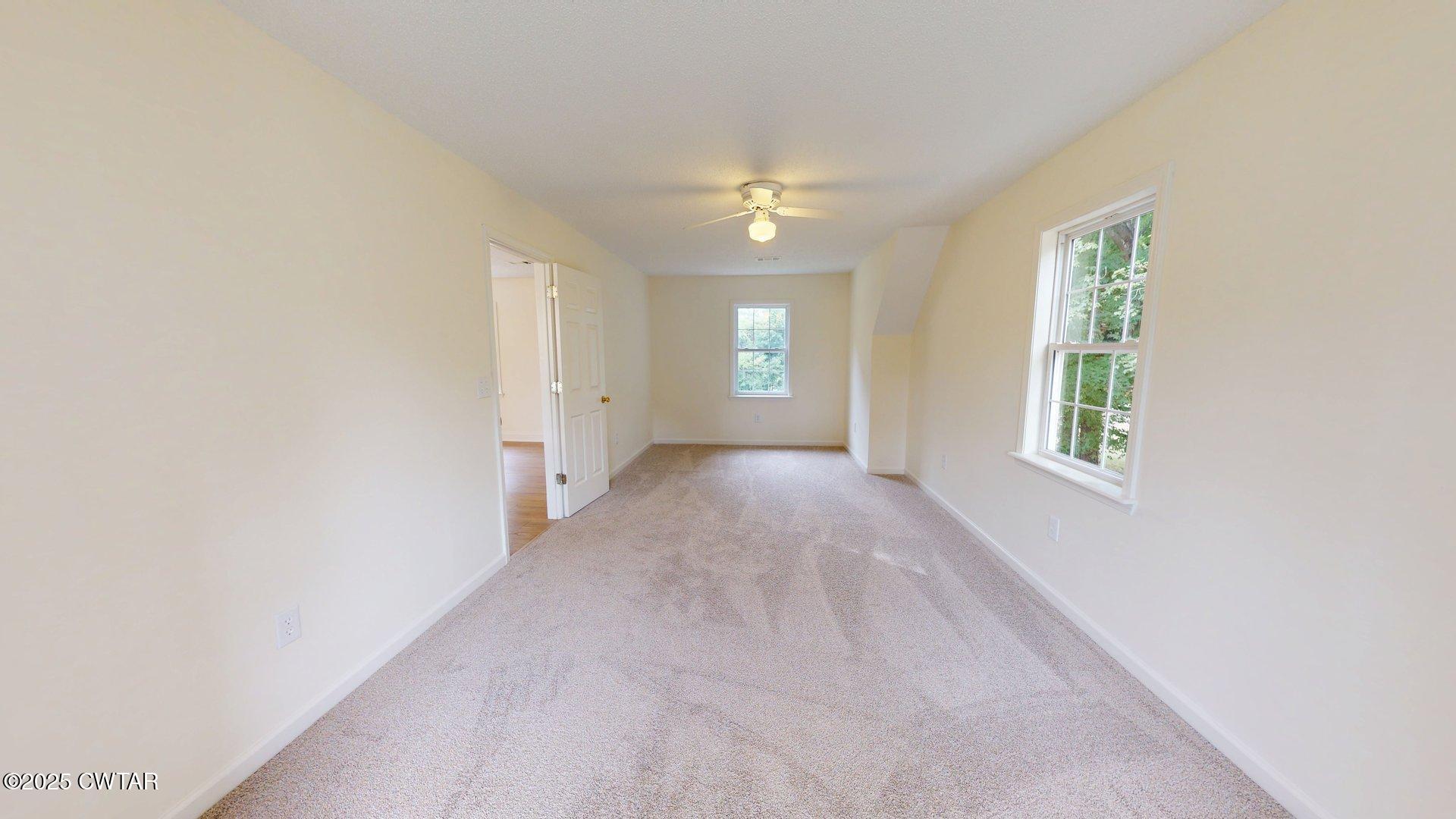 404 West Main Street Newbern, TN 38059 - Photo 29 of 35 an empty room with windows and closet