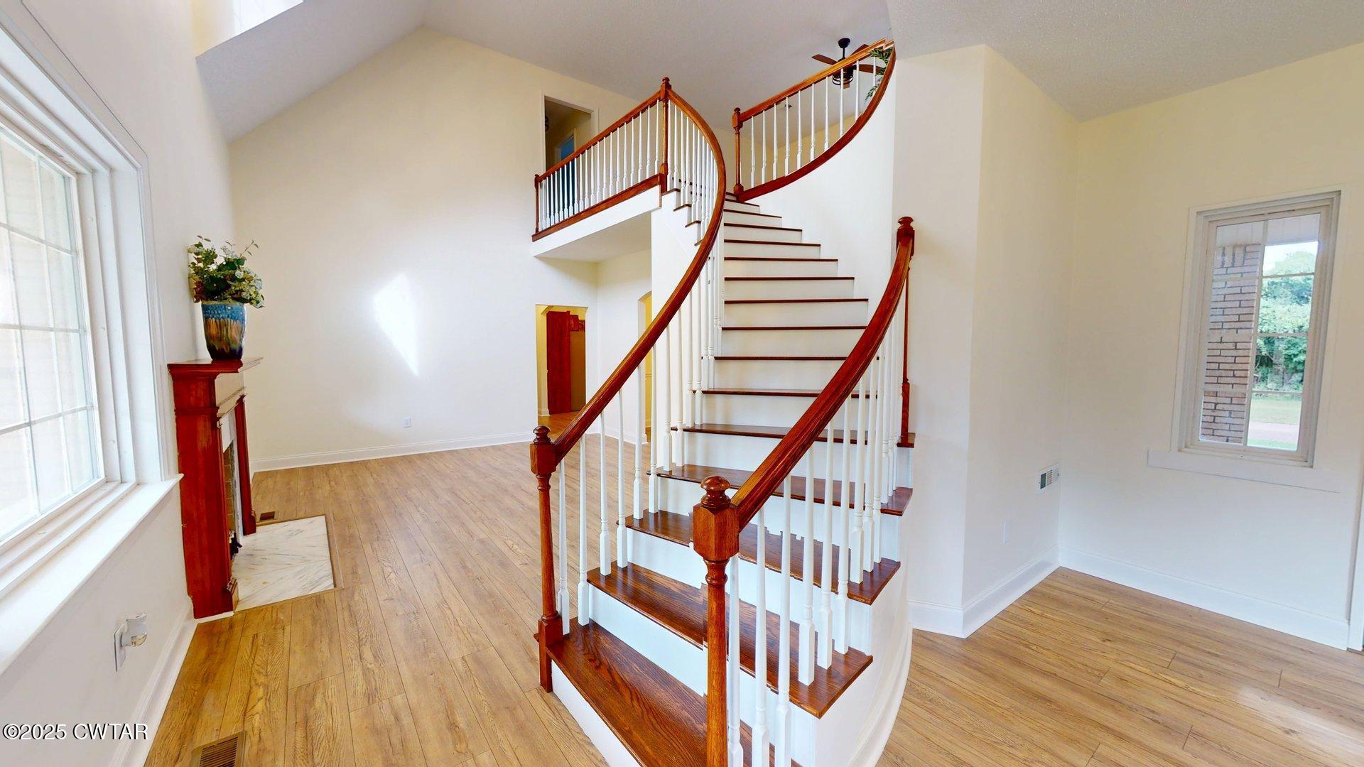 404 West Main Street Newbern, TN 38059 - Photo 3 of 35 a view of entryway with wooden floor and stairs