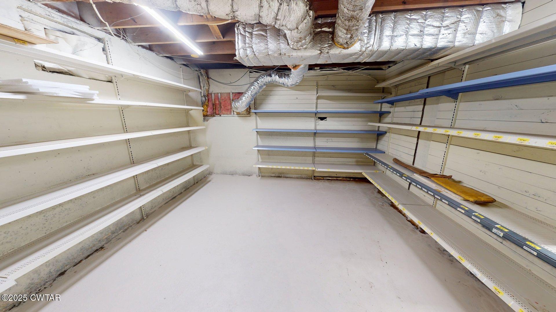 404 West Main Street Newbern, TN 38059 - Photo 31 of 35 a view of store room with racks