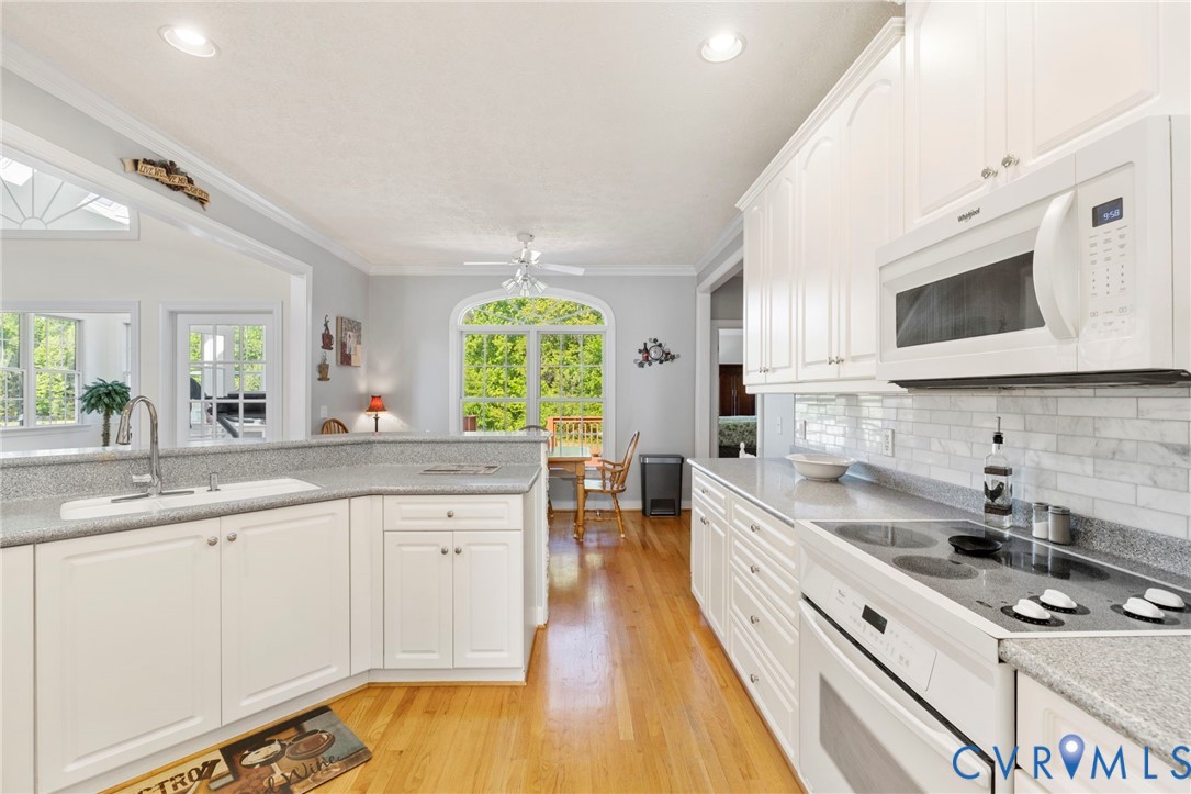 15441 Goshen Road Montpelier, VA 23192 - Photo 20 of 47 a large kitchen with stainless steel appliances a white wooden cabinets and a sink