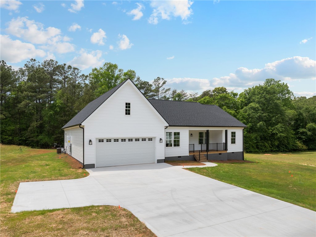 1735 Maw Bridge Road Central, SC 29630 - Photo 3 of 38 This charming home offers a spacious driveway, welcoming porch, and a lush, expansive yard.