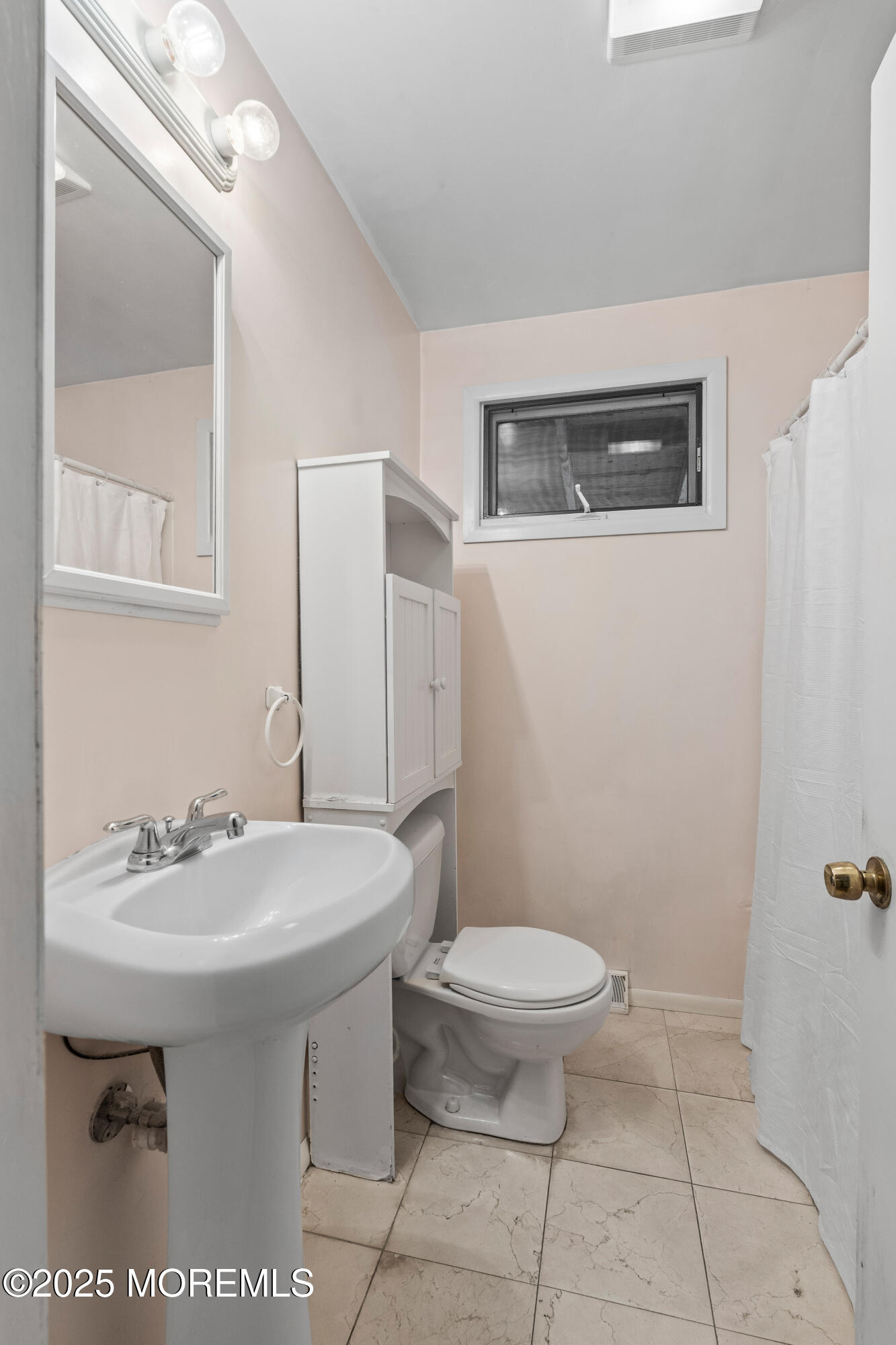 9 Monmouth Place Keyport, NJ 07735 - Photo 12 of 28 a bathroom with a sink a toilet and a mirror