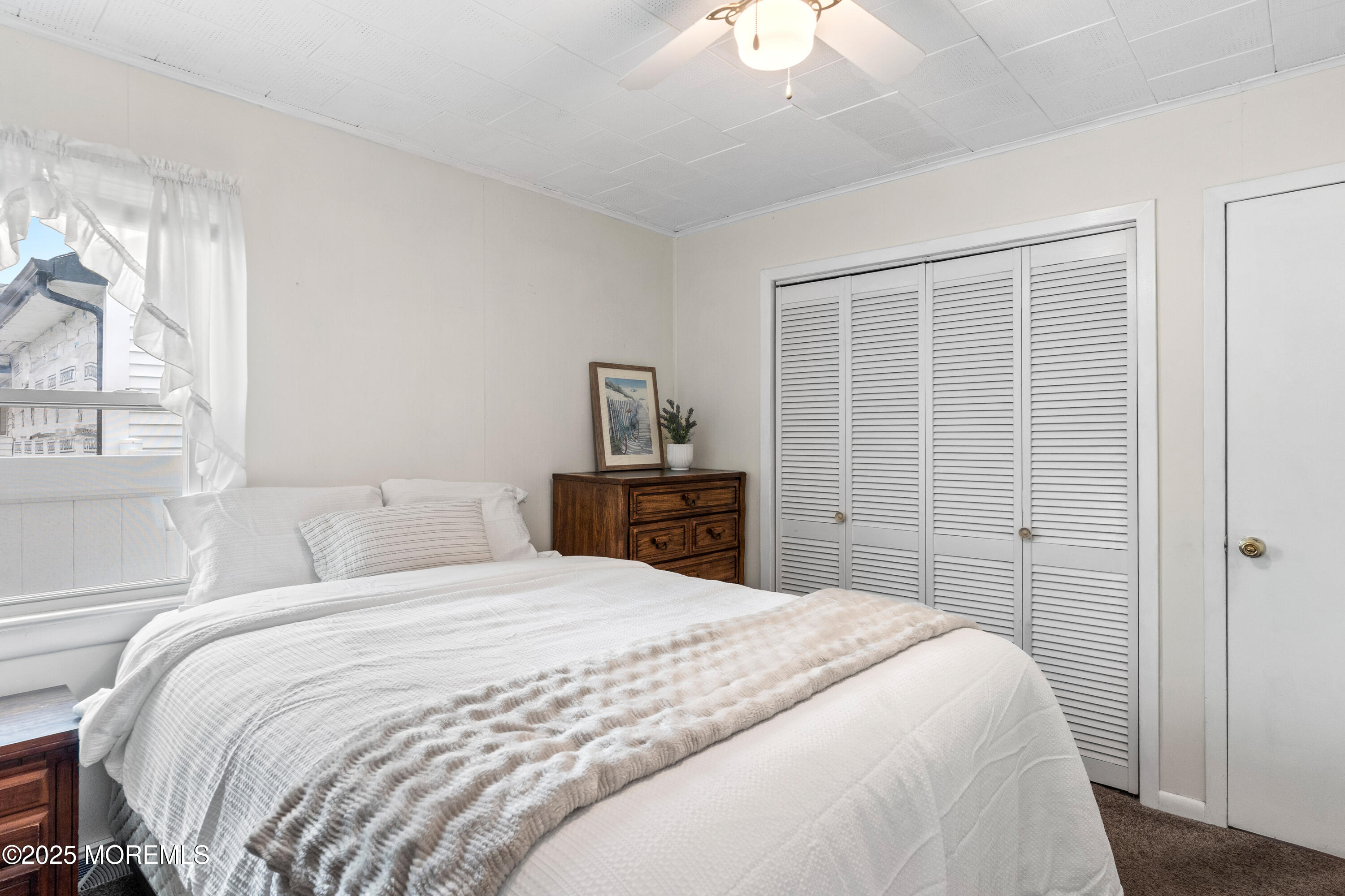 9 Monmouth Place Keyport, NJ 07735 - Photo 13 of 28 a bedroom with a bed and a window