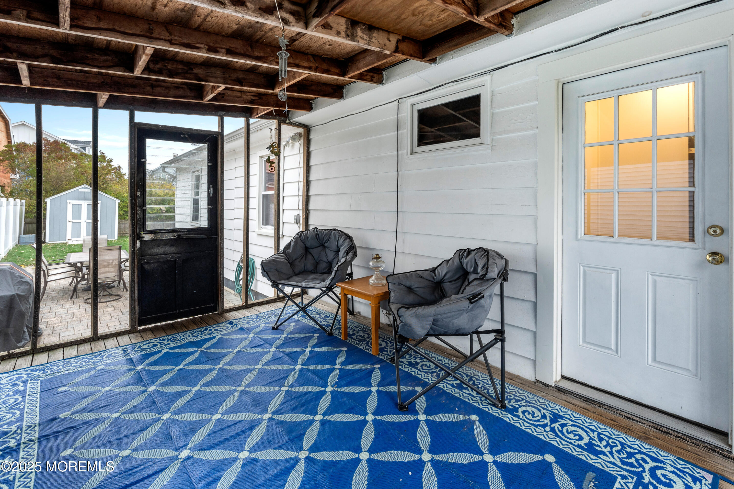 9 Monmouth Place Keyport, NJ 07735 - Photo 18 of 28 a living room with furniture and a floor to ceiling window