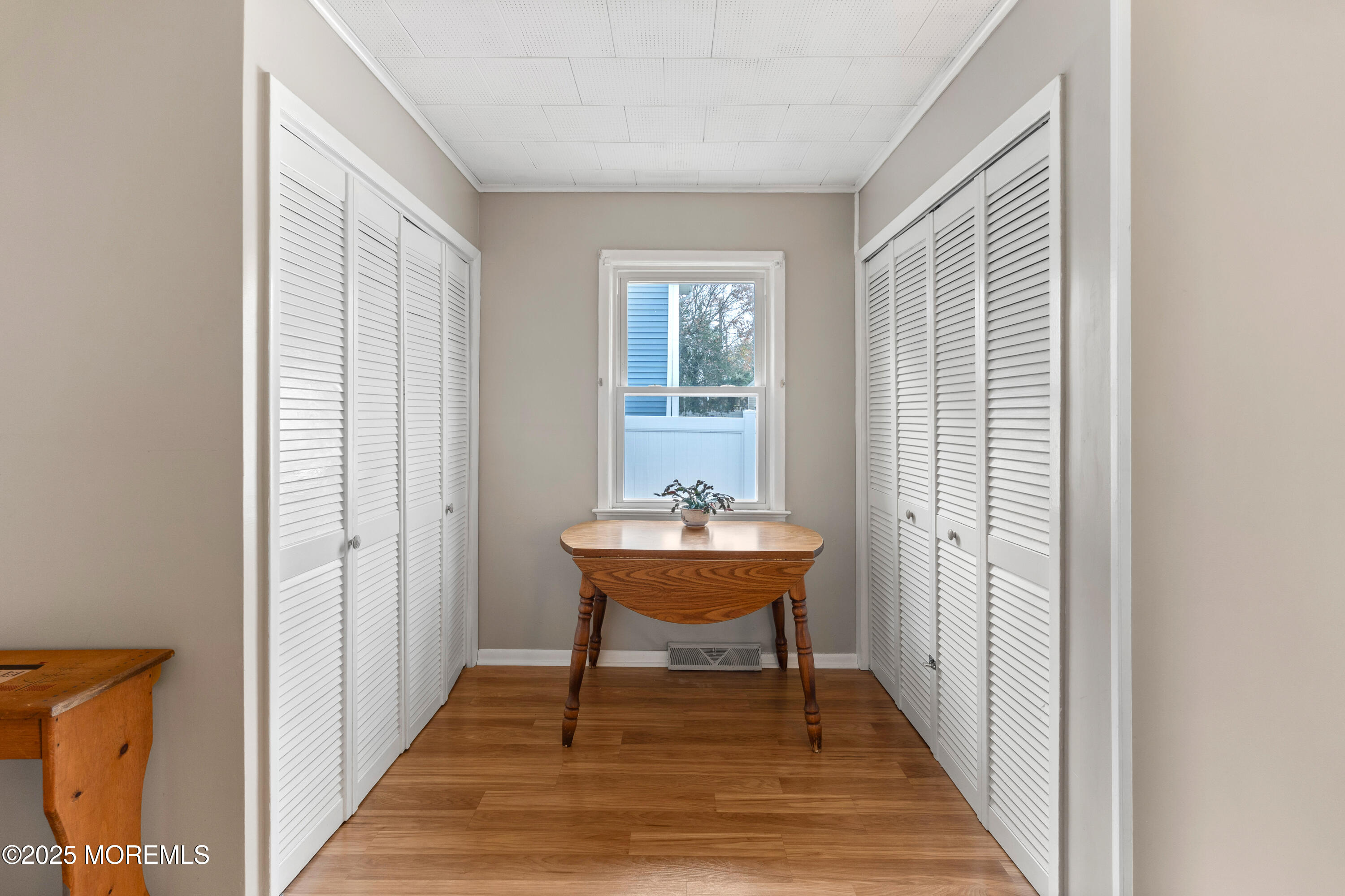 9 Monmouth Place Keyport, NJ 07735 - Photo 19 of 28 a view of a bedroom with a bed and wooden floor