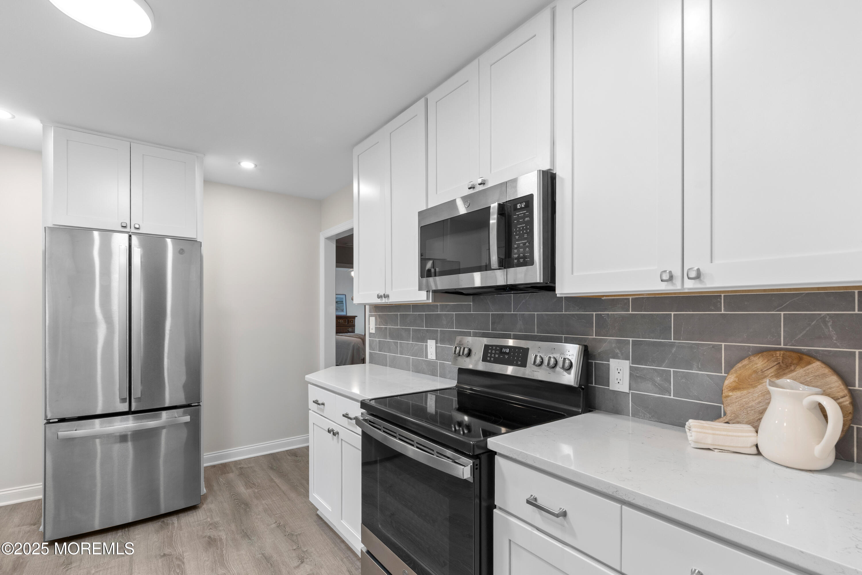 9 Monmouth Place Keyport, NJ 07735 - Photo 8 of 28 a kitchen with a refrigerator stove and microwave