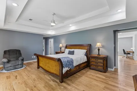 a bedroom with a bed and window