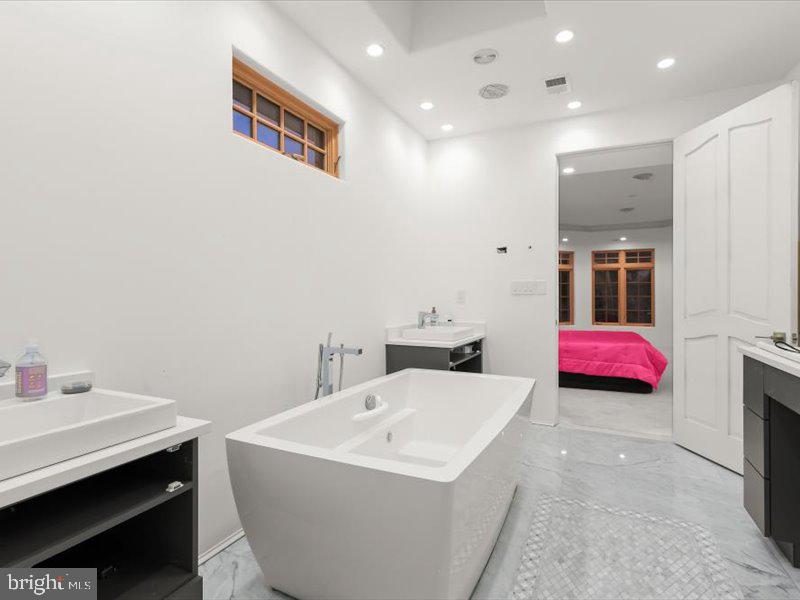 10130 Counselman Road Potomac, MD 20854 - Photo 122 of 135 a bathroom with a sink and a bathtub