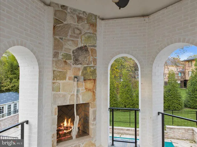 an empty room with windows and bathroom view