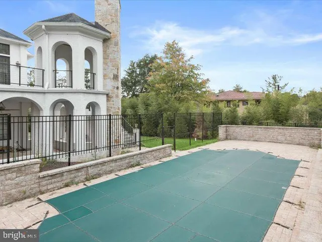 a front view of a house with a garden and plants