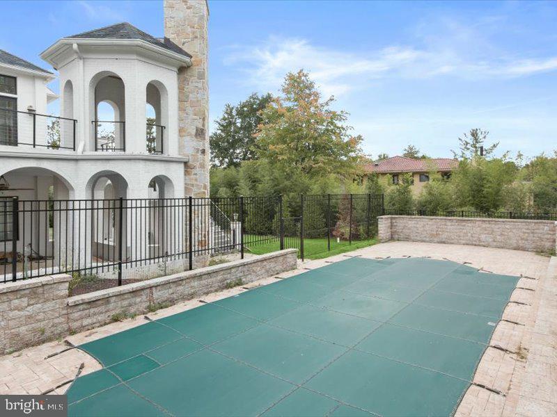 10130 Counselman Road Potomac, MD 20854 - Photo 2 of 135 a view of a brick house with large windows