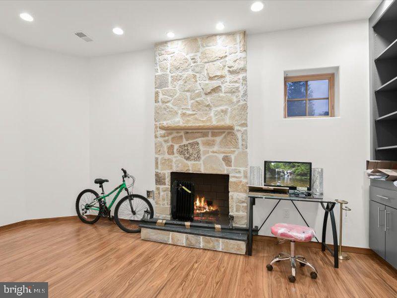 10130 Counselman Road Potomac, MD 20854 - Photo 29 of 135 a living room with furniture and a fireplace