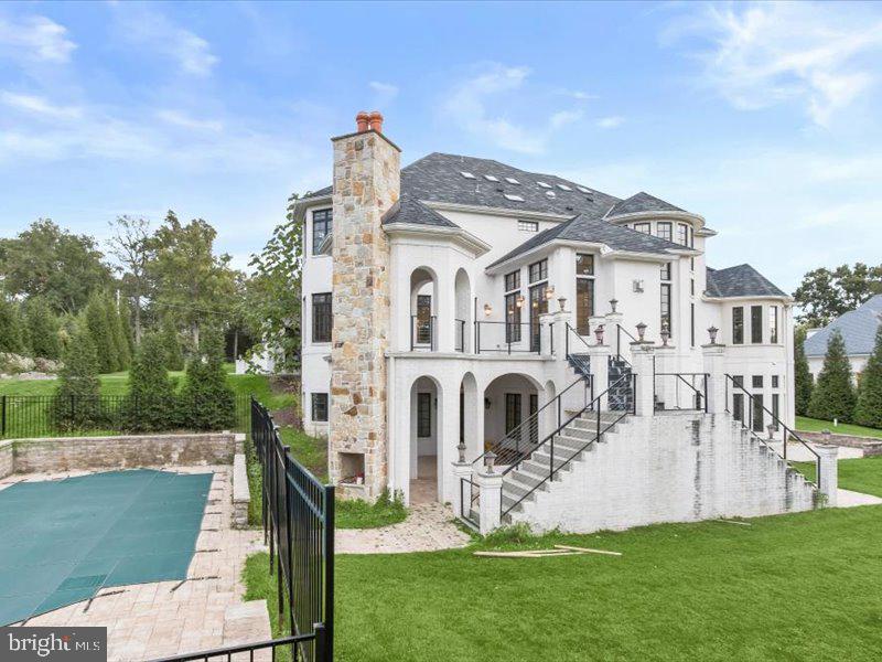 10130 Counselman Road Potomac, MD 20854 - Photo 3 of 135 a front view of a house with a garden and plants
