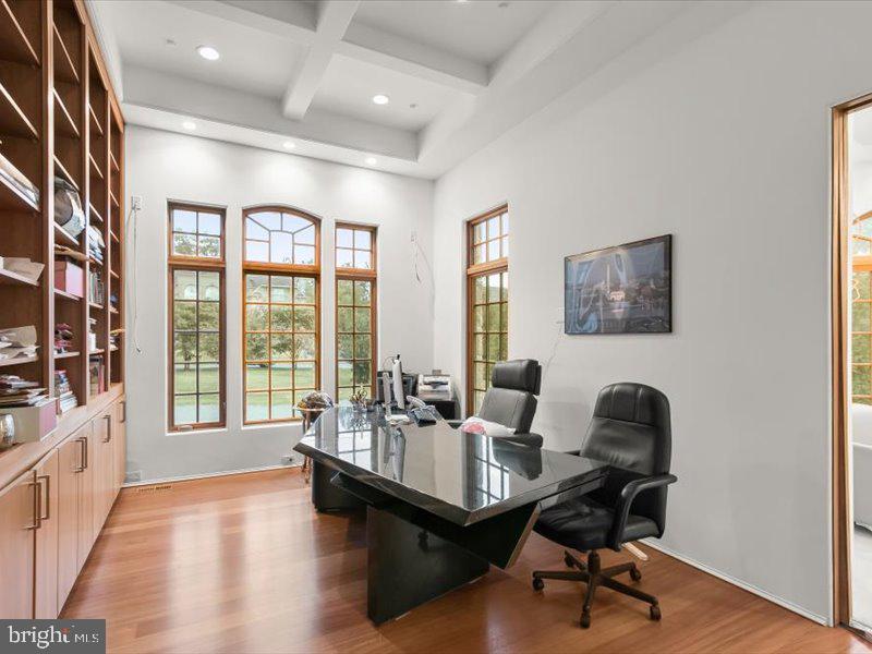 10130 Counselman Road Potomac, MD 20854 - Photo 32 of 135 a living room with furniture and a floor to ceiling window