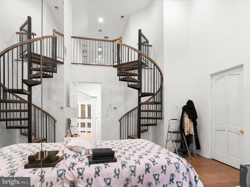 10130 Counselman Road Potomac, MD 20854 - Photo 54 of 135 a view of a bedroom with furniture and staircase