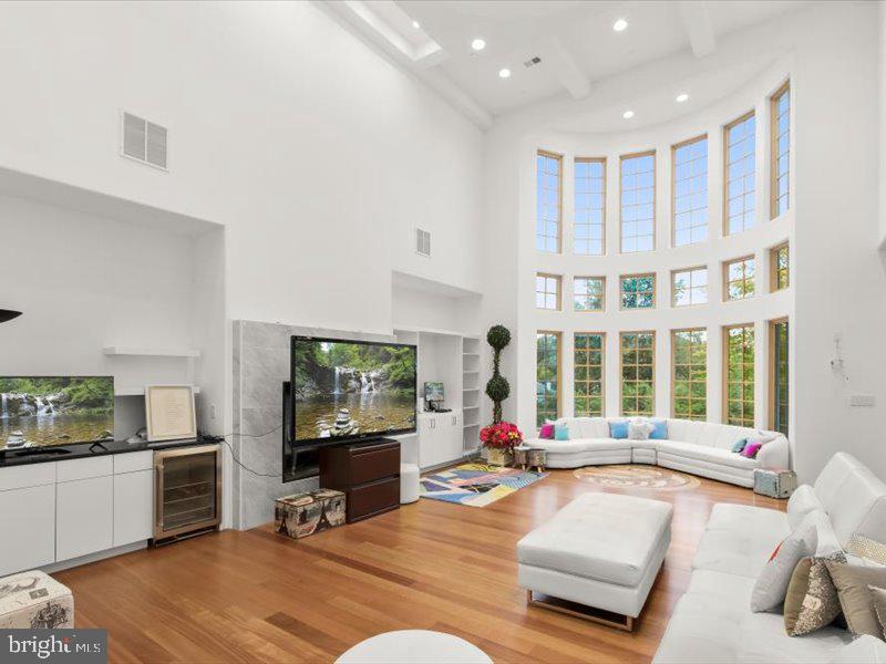 10130 Counselman Road Potomac, MD 20854 - Photo 63 of 135 a living room with furniture and a flat screen tv