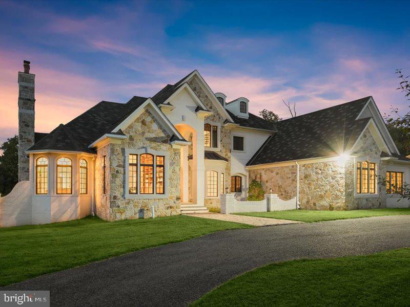 10130 Counselman Road Potomac, MD 20854 - Photo 7 of 135 a front view of a house with a garden