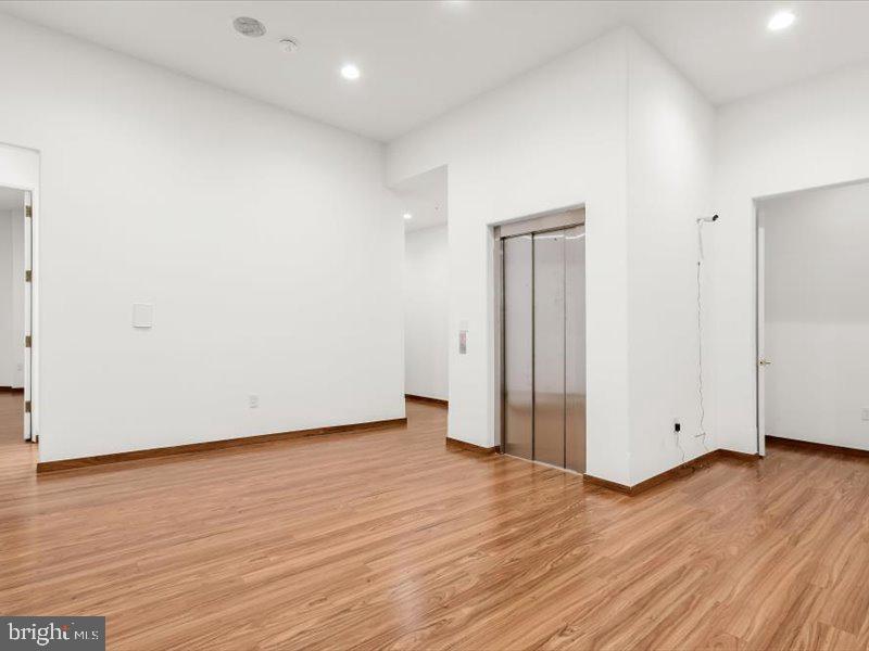 10130 Counselman Road Potomac, MD 20854 - Photo 85 of 135 a view of an empty room with wooden floor and closet