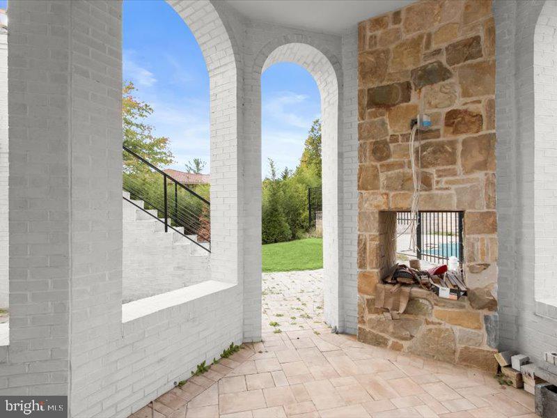 10130 Counselman Road Potomac, MD 20854 - Photo 92 of 135 a view of a porch with chairs and backyard of the house