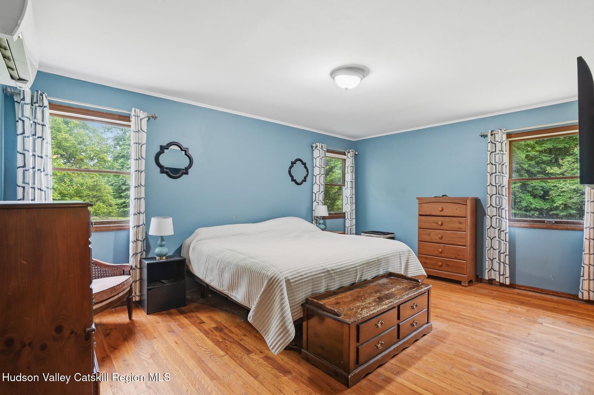 984 Blue Mountain Road Saugerties, NY 12477 - Photo 14 of 24 a bed sitting in a bedroom next to a window