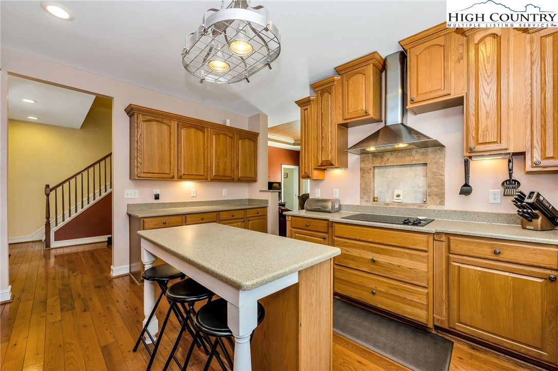 3186-3190 Silas Creek Road Lansing, NC 28643 - Photo 16 of 50 a kitchen with stainless steel appliances granite countertop a sink and cabinets