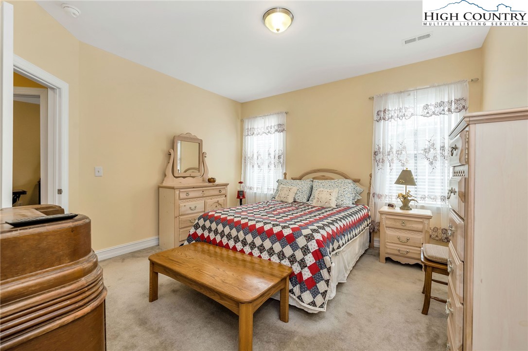 3186-3190 Silas Creek Road Lansing, NC 28643 - Photo 25 of 50 a bedroom with bed and window
