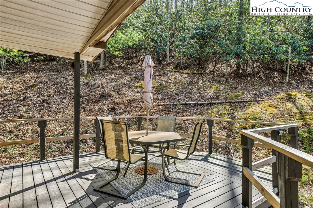 3186-3190 Silas Creek Road Lansing, NC 28643 - Photo 35 of 50 a view of a chairs and table in the patio