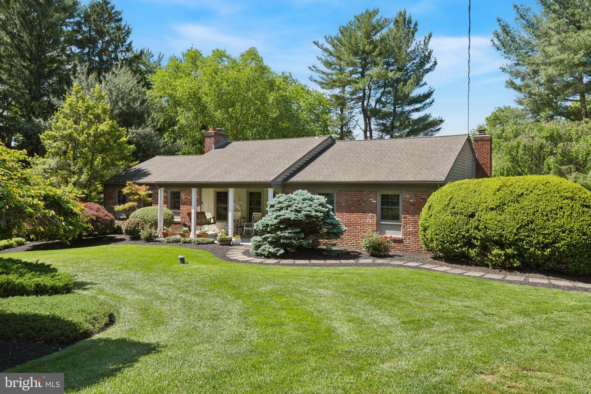 a view of a house with garden and yard