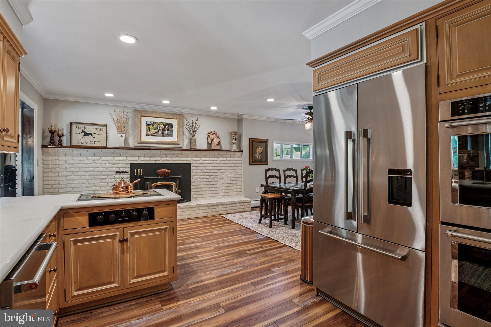 432 Spring Valley Road Media, PA 19063 - Photo 11 of 46 a kitchen with granite countertop a refrigerator and a stove top oven