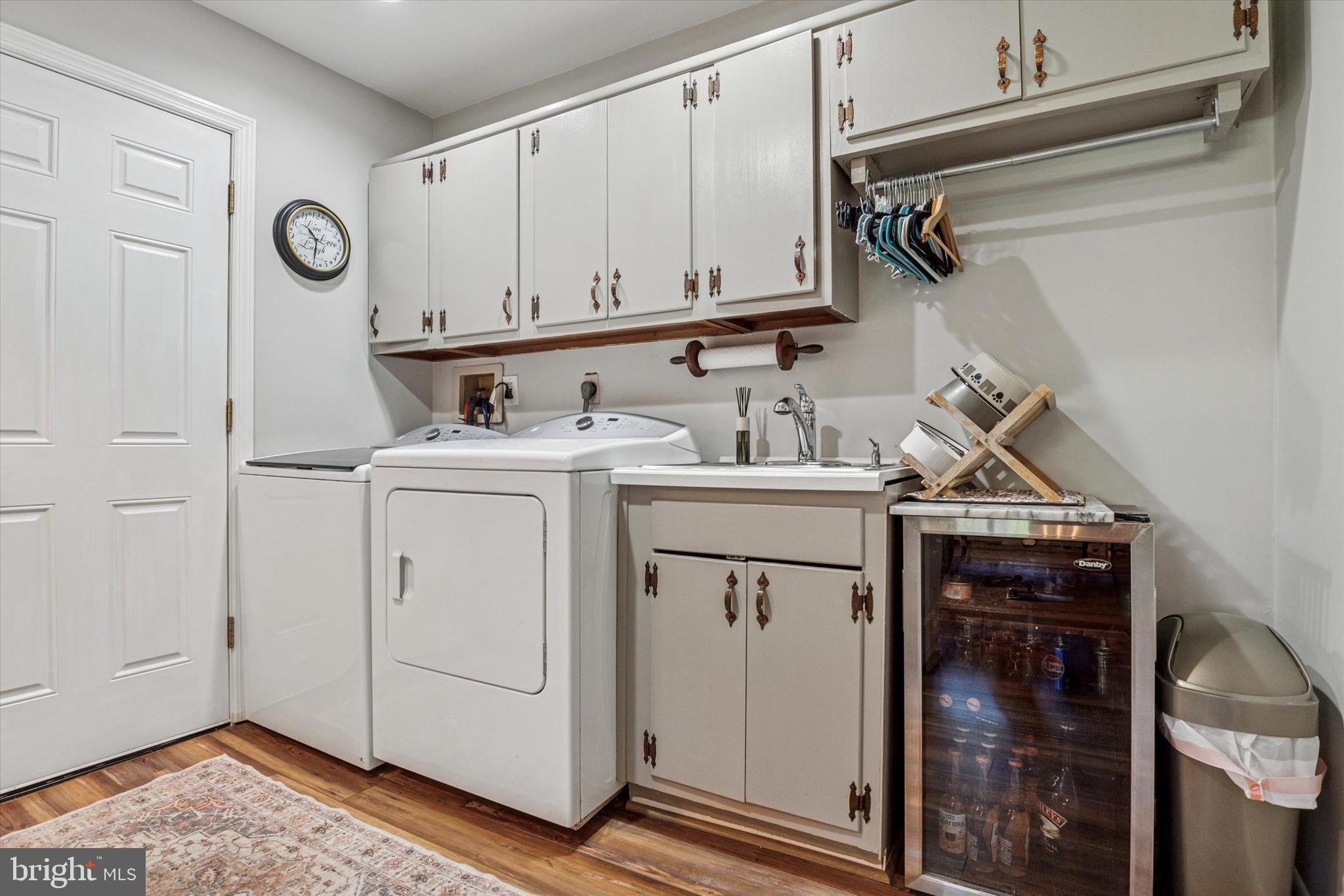 432 Spring Valley Road Media, PA 19063 - Photo 14 of 46 a utility room with cabinets washer and dryer