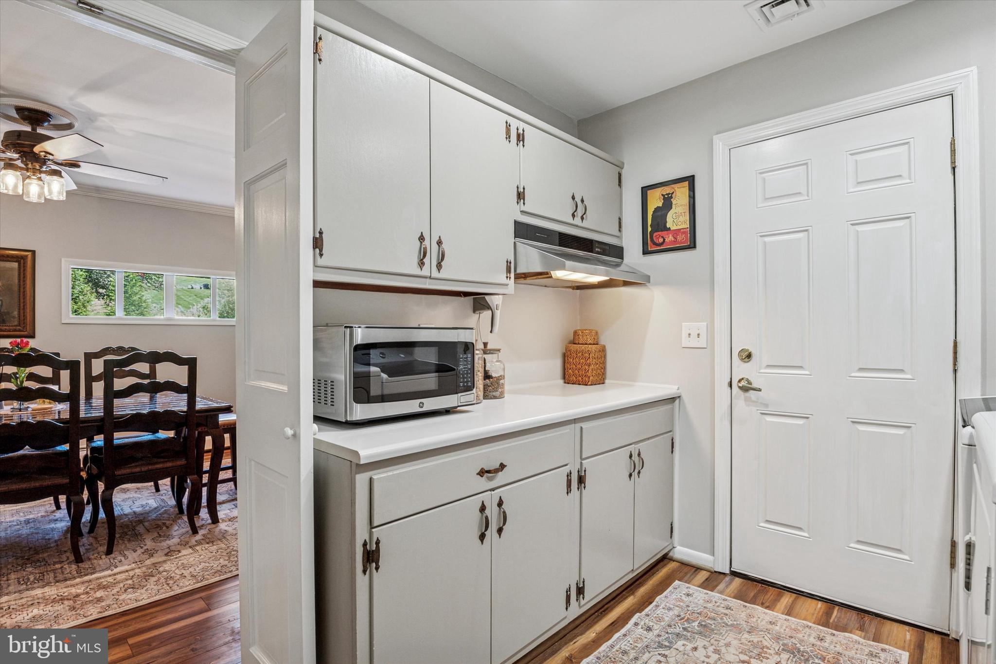 432 Spring Valley Road Media, PA 19063 - Photo 15 of 46 a kitchen with white cabinets and appliances