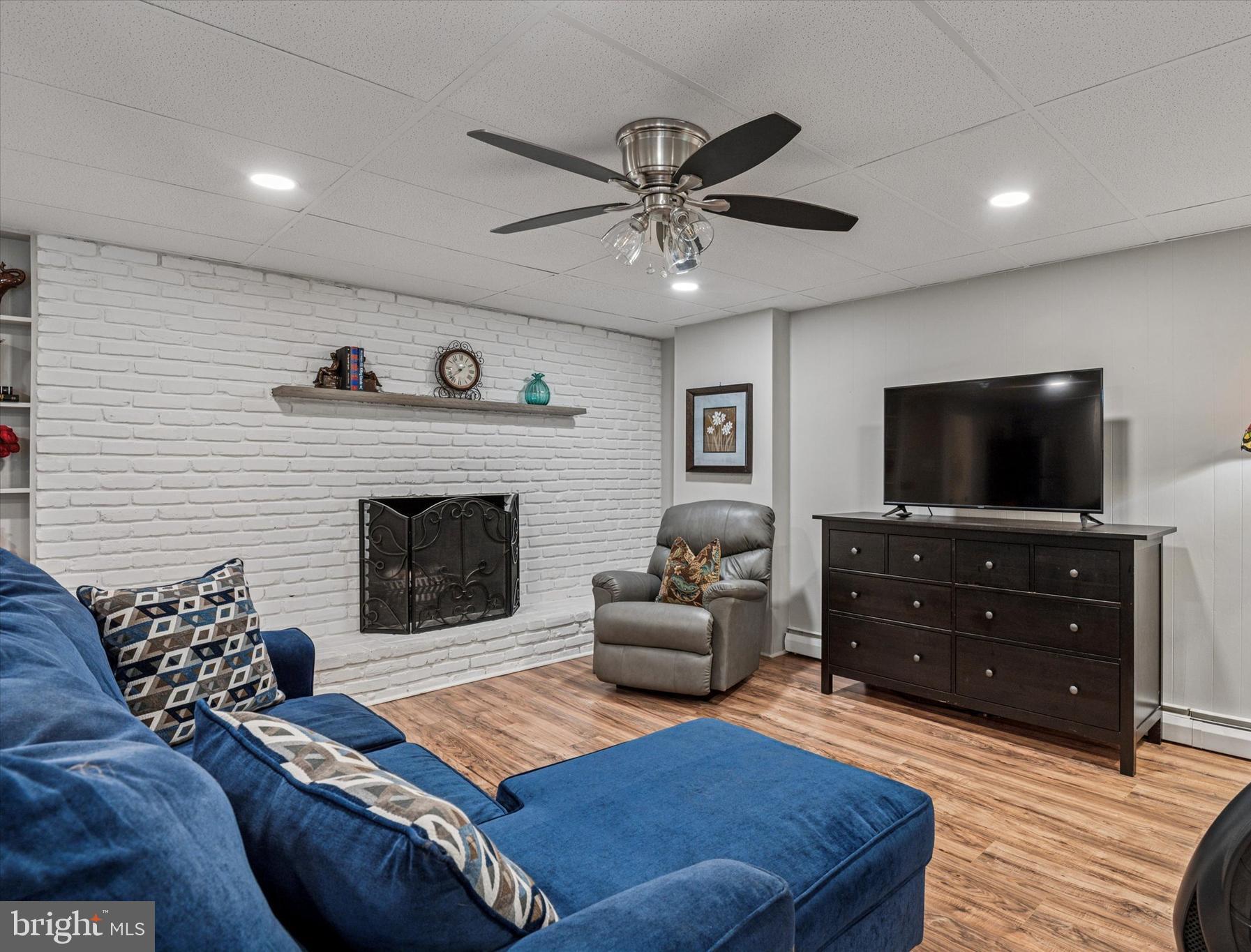 432 Spring Valley Road Media, PA 19063 - Photo 30 of 46 a living room with furniture and a flat screen tv