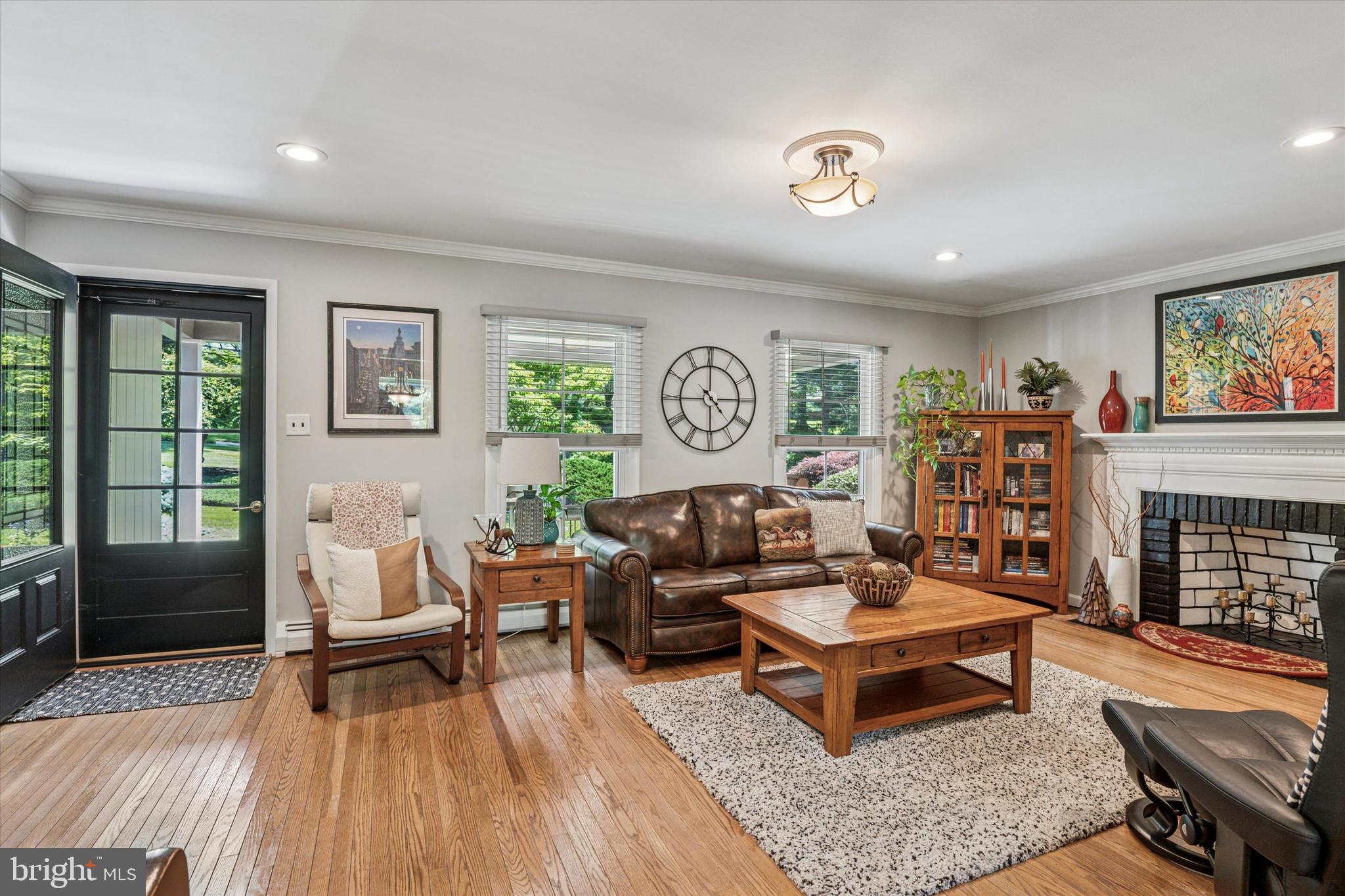 432 Spring Valley Road Media, PA 19063 - Photo 3 of 46 a living room with furniture and a fireplace