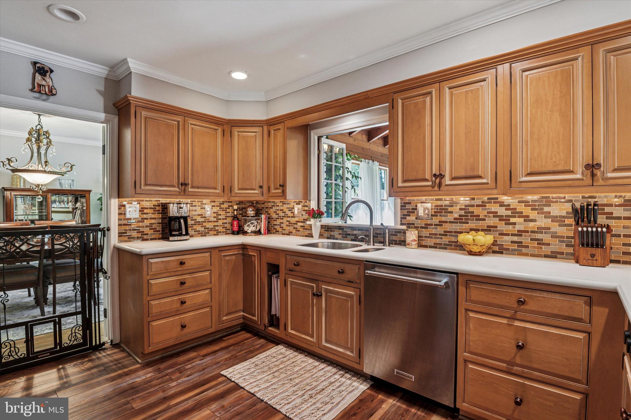 432 Spring Valley Road Media, PA 19063 - Photo 9 of 46 a kitchen with stainless steel appliances granite countertop a sink window and cabinets