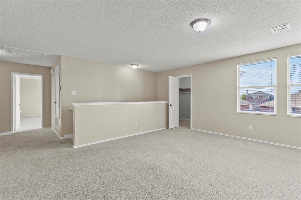 3004 Deer Ridge Drive Rockwall, TX 75032 - Photo 13 of 25 a view of an empty room with a window
