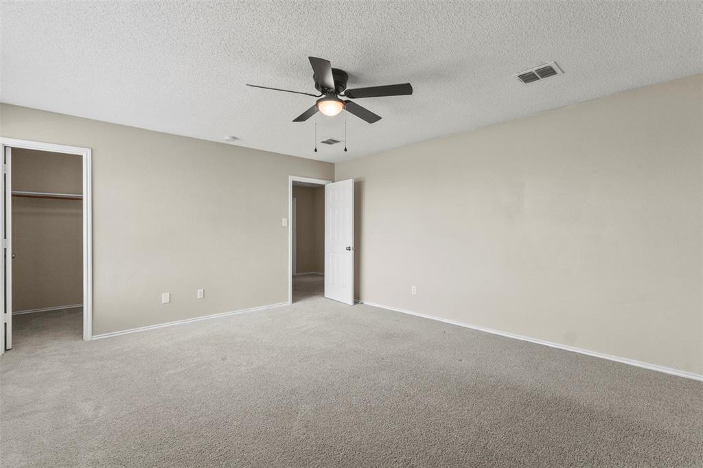 3004 Deer Ridge Drive Rockwall, TX 75032 - Photo 16 of 25 a view of an empty room with a ceiling fan