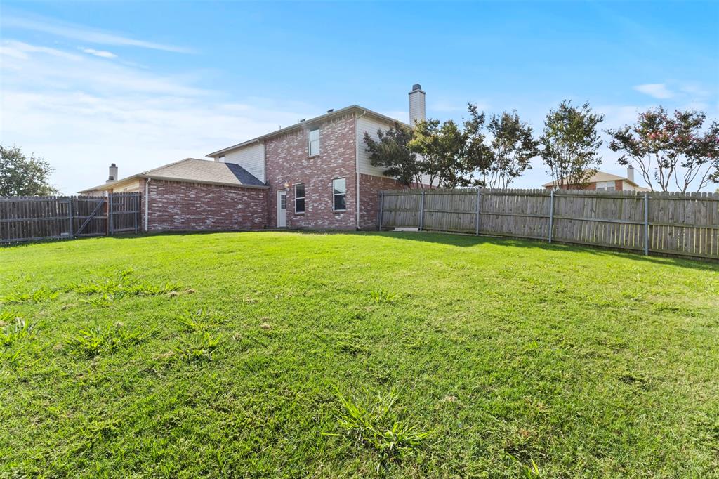 3004 Deer Ridge Drive Rockwall, TX 75032 - Photo 22 of 25 a view of a house with a yard and a large tree