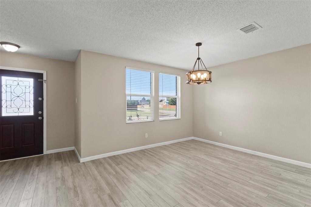 3004 Deer Ridge Drive Rockwall, TX 75032 - Photo 7 of 25 wooden floor in an empty room with a window