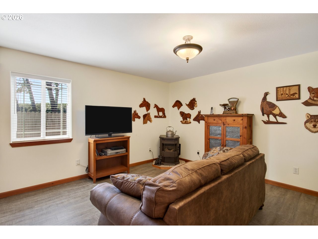 3956 Beach Loop Drive Southwest Bandon, OR 97411 - Photo 23 of 48 a living room with furniture and a flat screen tv