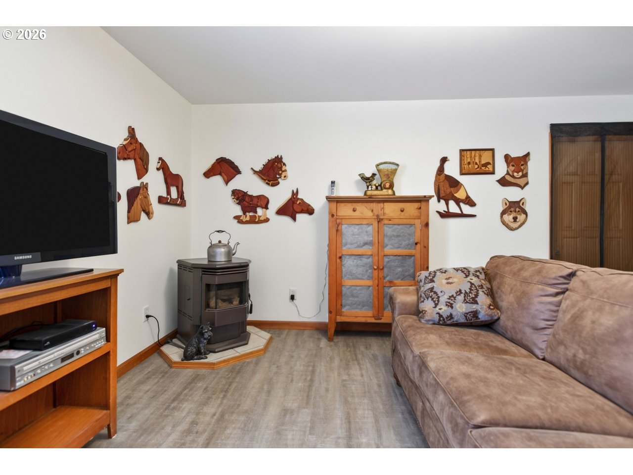 3956 Beach Loop Drive Southwest Bandon, OR 97411 - Photo 24 of 48 a living room with furniture and a flat screen tv