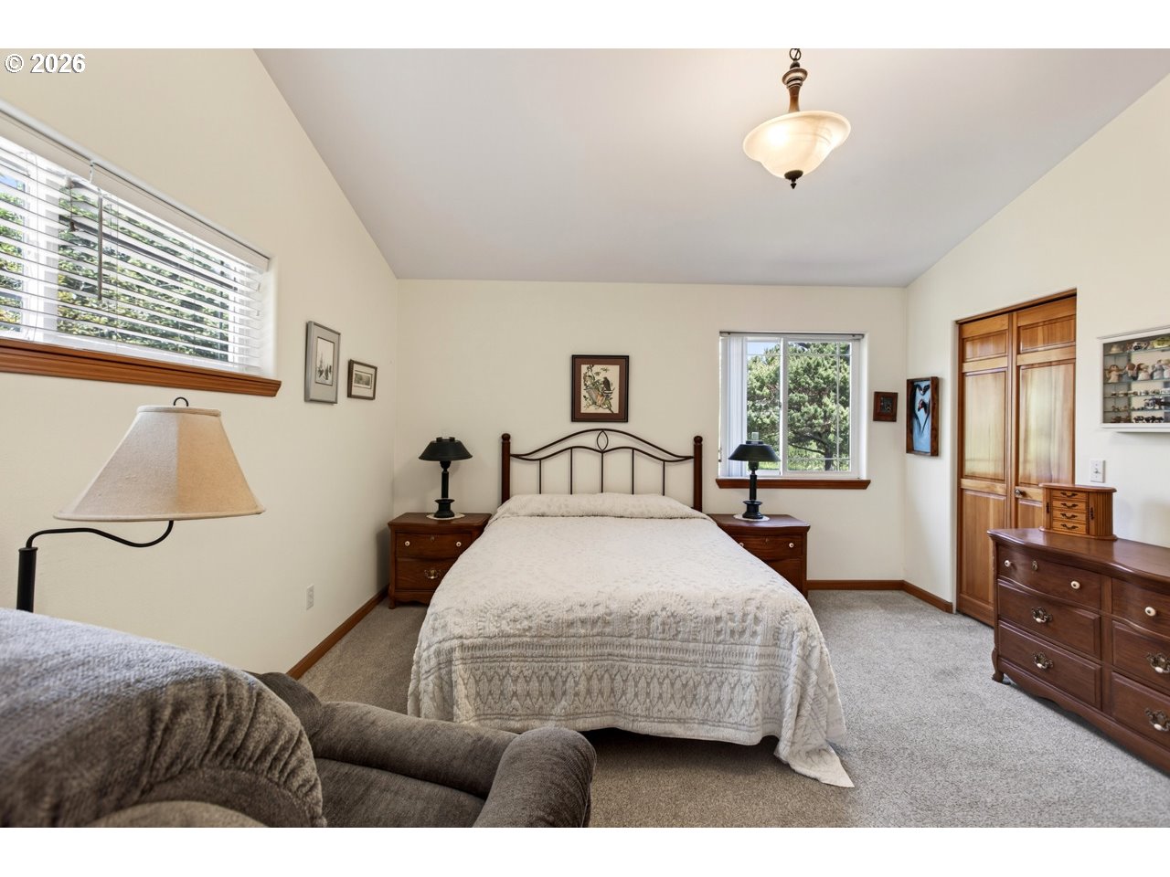 3956 Beach Loop Drive Southwest Bandon, OR 97411 - Photo 26 of 48 a bedroom with a bed and window