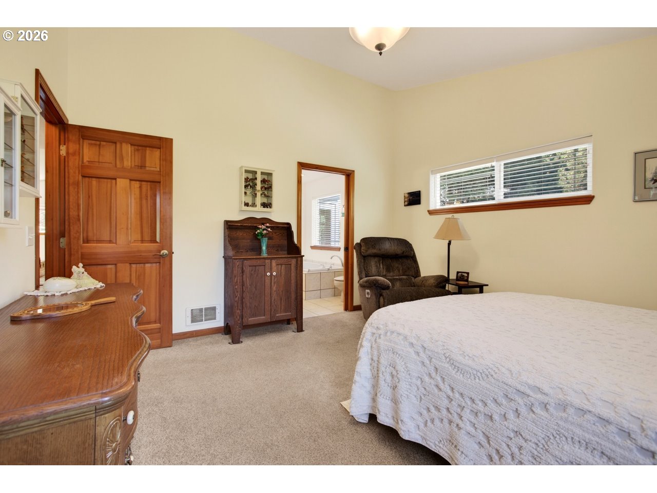 3956 Beach Loop Drive Southwest Bandon, OR 97411 - Photo 27 of 48 a bedroom with a bed and dresser
