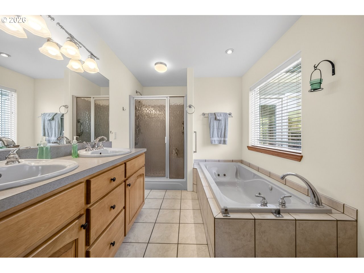 3956 Beach Loop Drive Southwest Bandon, OR 97411 - Photo 28 of 48 a bathroom with a bathtub sink and mirror