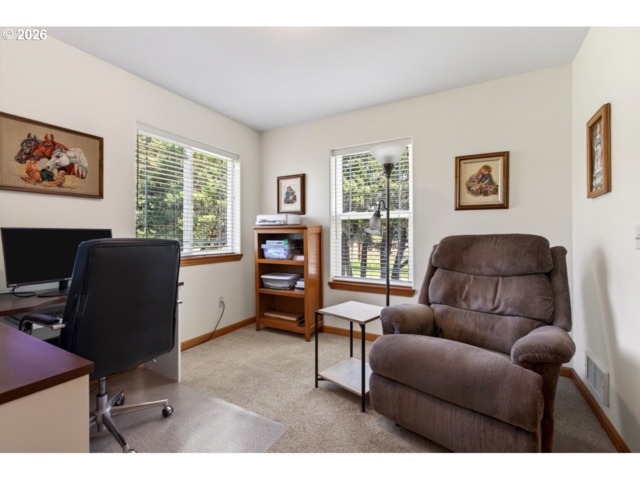 3956 Beach Loop Drive Southwest Bandon, OR 97411 - Photo 30 of 48 a living room with furniture and a flat screen tv