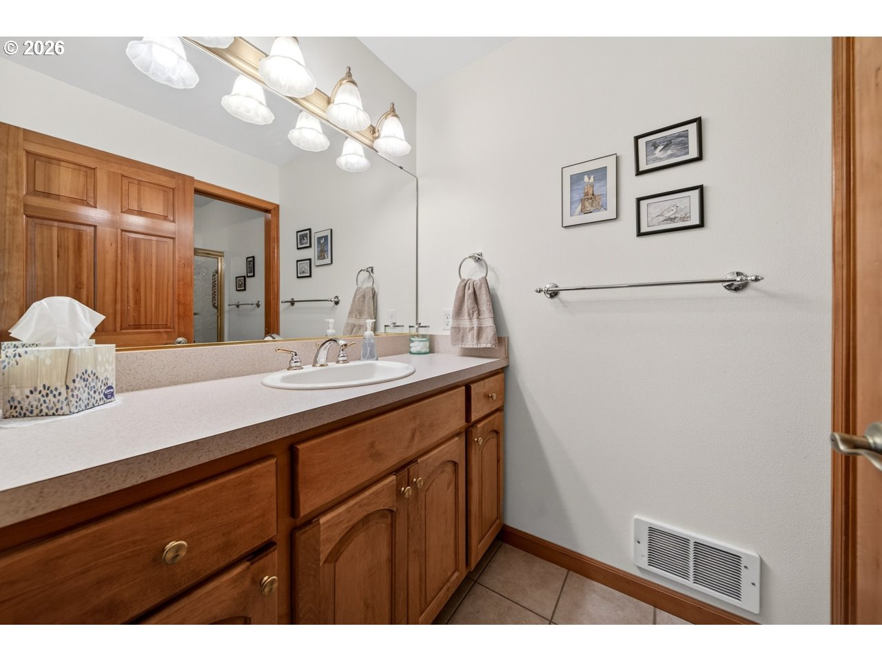 3956 Beach Loop Drive Southwest Bandon, OR 97411 - Photo 34 of 48 a bathroom with a sink a vanity and a mirror