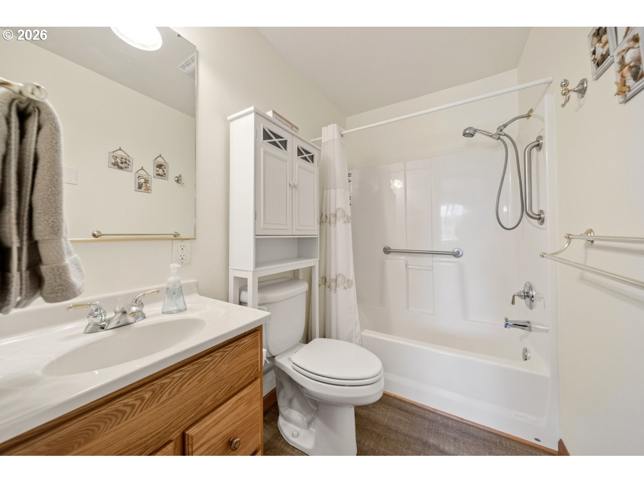 3956 Beach Loop Drive Southwest Bandon, OR 97411 - Photo 36 of 48 a bathroom with a sink a toilet and shower