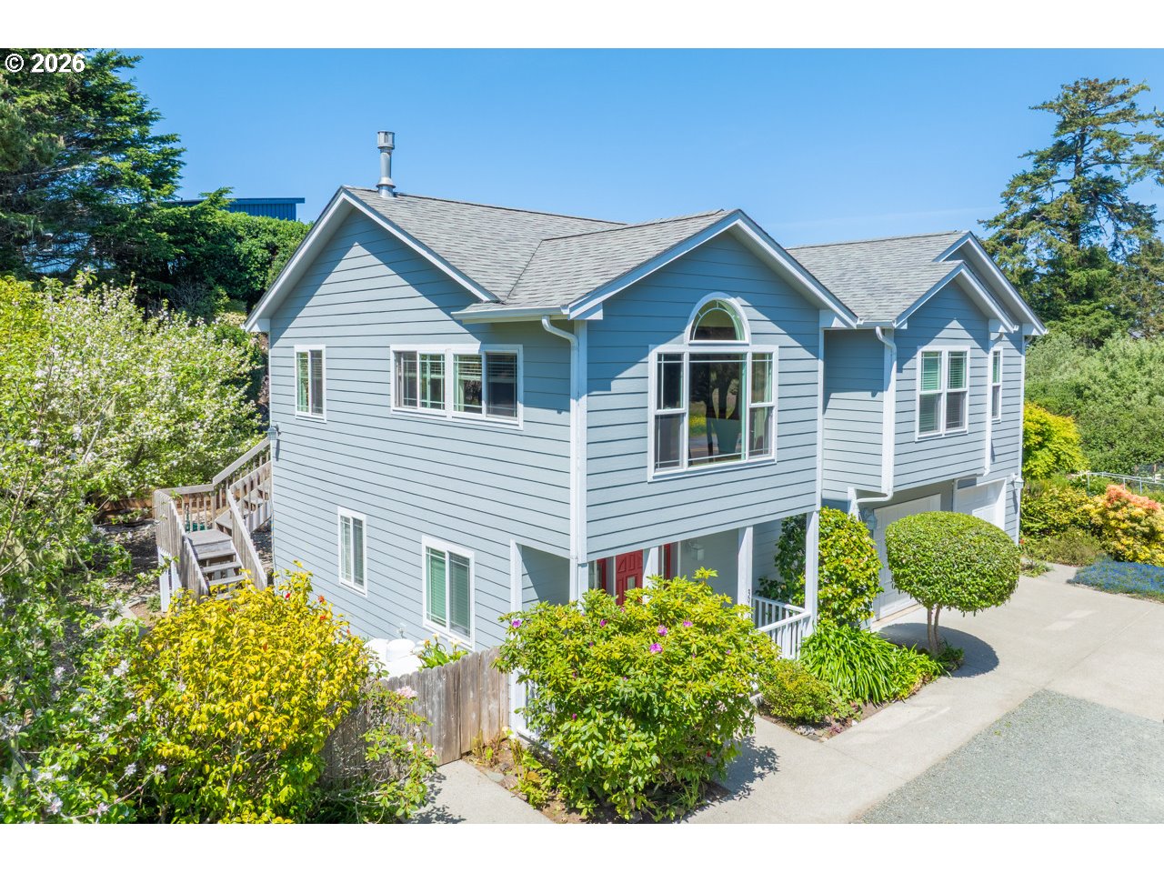 3956 Beach Loop Drive Southwest Bandon, OR 97411 - Photo 5 of 48 a front view of a house with garden